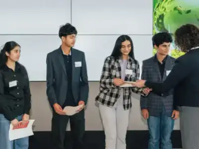AT Academy students receiving their case competition certificates